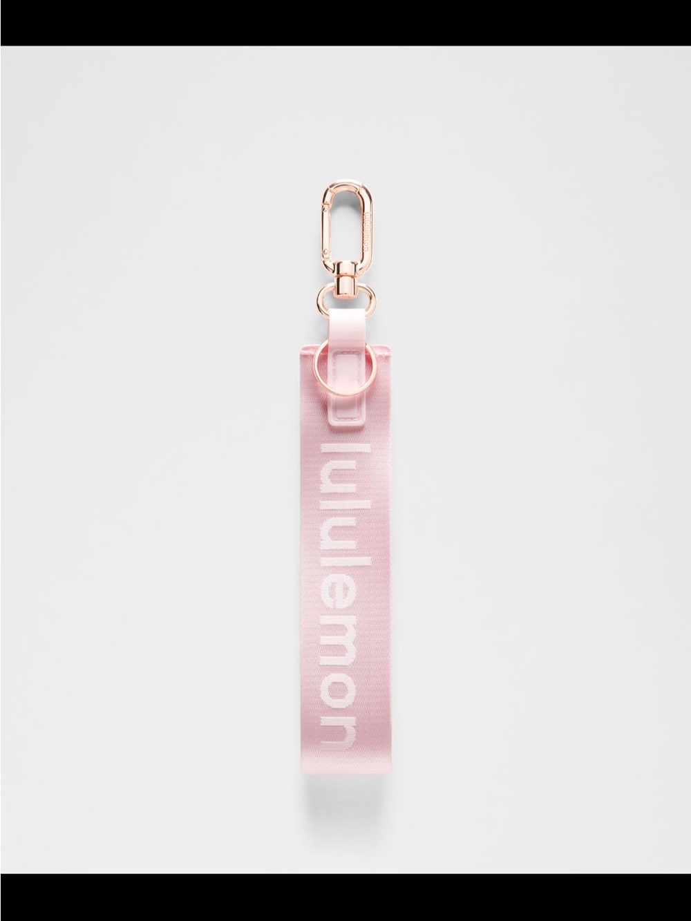 NWOT Lululemon Never Lost Keychain in color Pink Pearl/White/Rose Gold Hardware